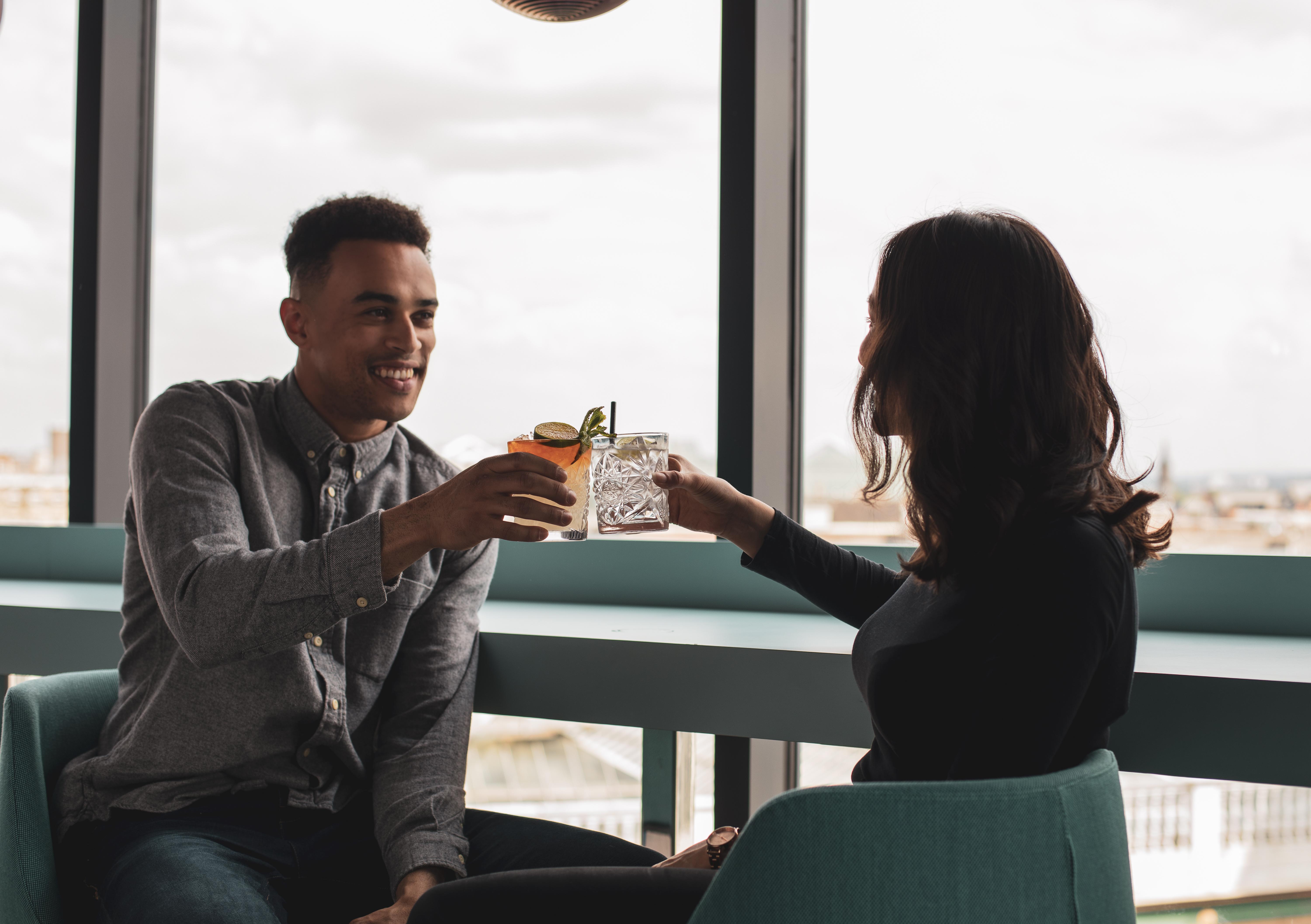 Yotel Glasgow Exterior photo A couple having drinks together.