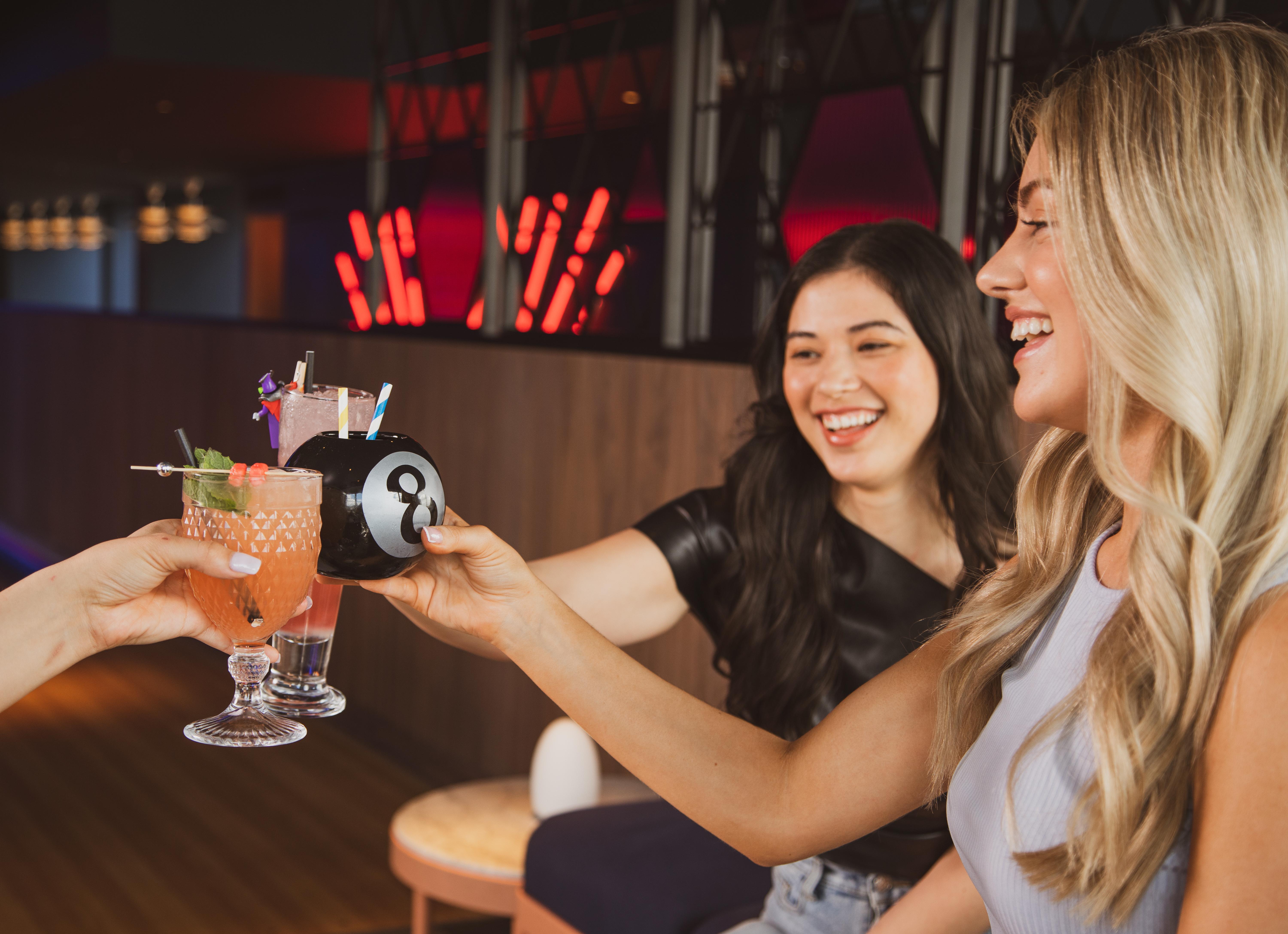 Yotel Glasgow Exterior photo Two women toasting with drinks.